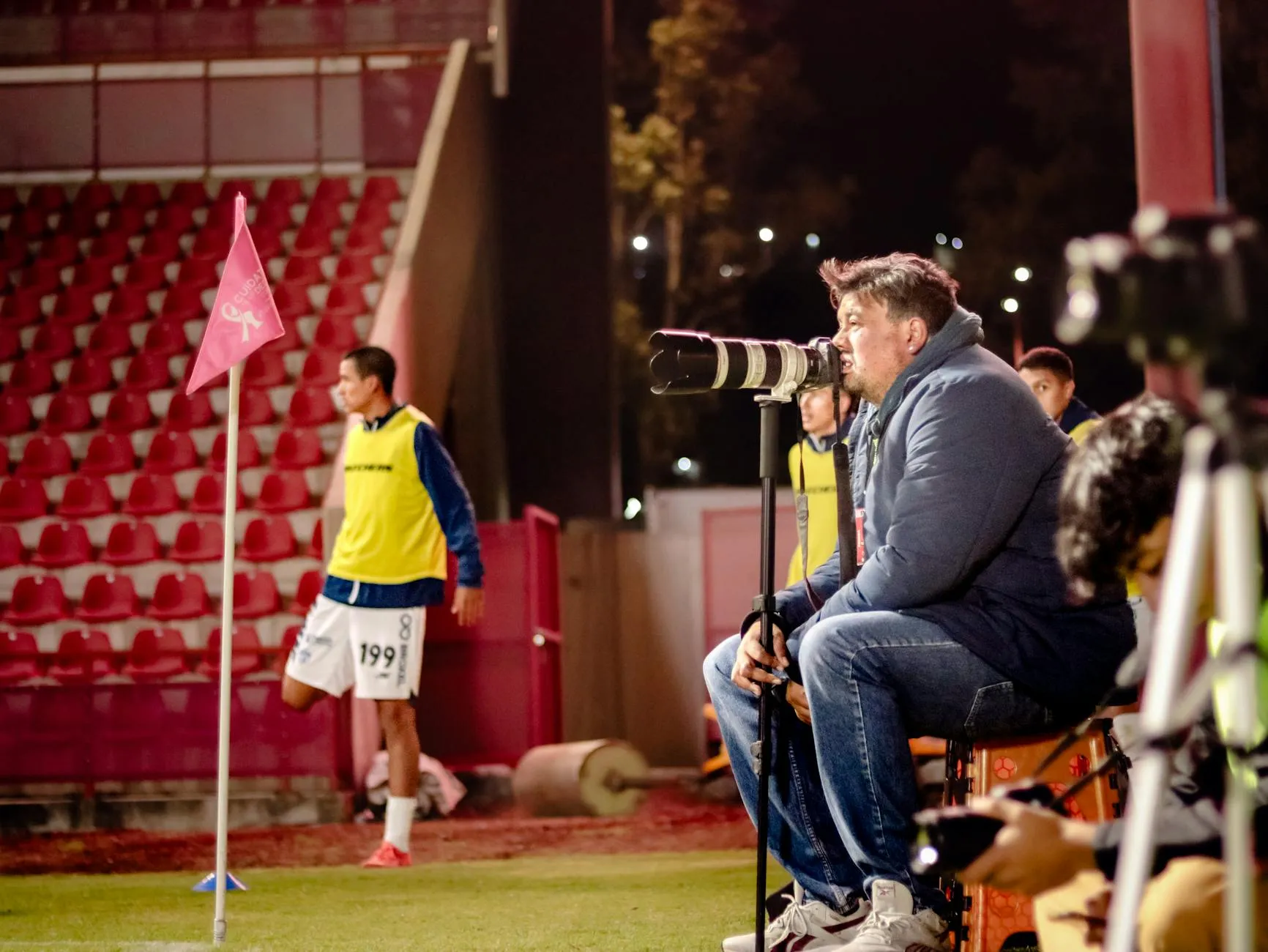 A national team captain standing pitchside at night, evoking the unresolved question of Robert Lewandowski's international future after Poland missed the 2026 World Cup