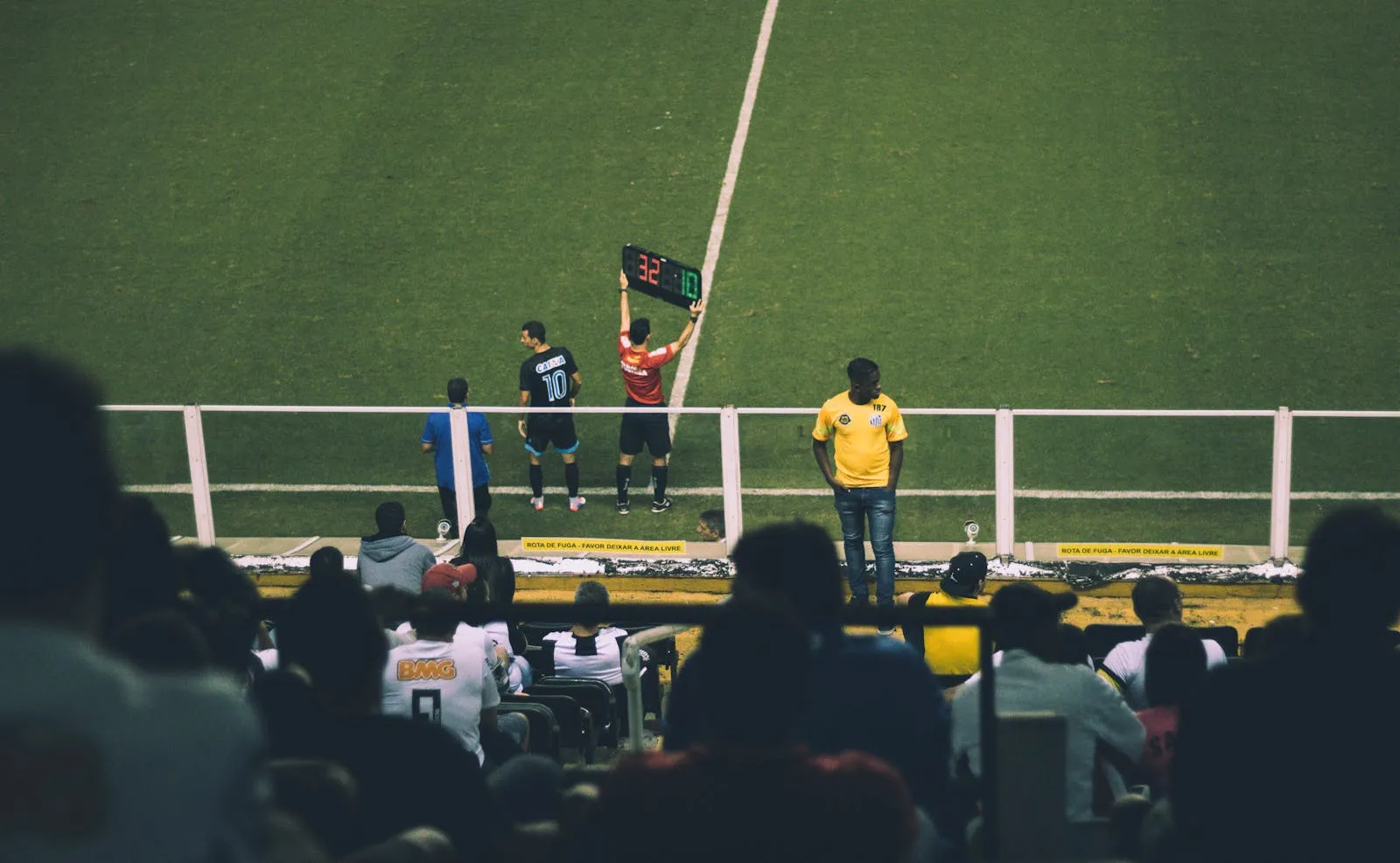 A substitution board held up pitchside — tactical rotation central to Spain's 2026 World Cup preparation