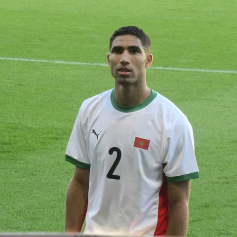 Achraf Hakimi of Morocco — Brazil vs Morocco opens World Cup 2026 Group C on June 13 at MetLife Stadium in East Rutherford, the first competitive meeting between the two and a rematch of the 2023 Tangier friendly Morocco won 2-1, with Hakimi's right flank against Vinícius the duel that decides it