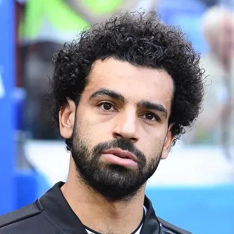 Mohamed Salah in Egypt's red national-team shirt — Liverpool's forward leads Egypt in Group G at World Cup 2026, his second World Cup after 2018, turning 34 on the day of Egypt's opener against Belgium on June 15